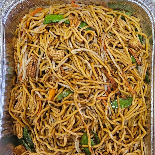 Mr Nosh's Chinese chow mein noodles with vegetables, including baby corn, bean sprouts, and carrots.
