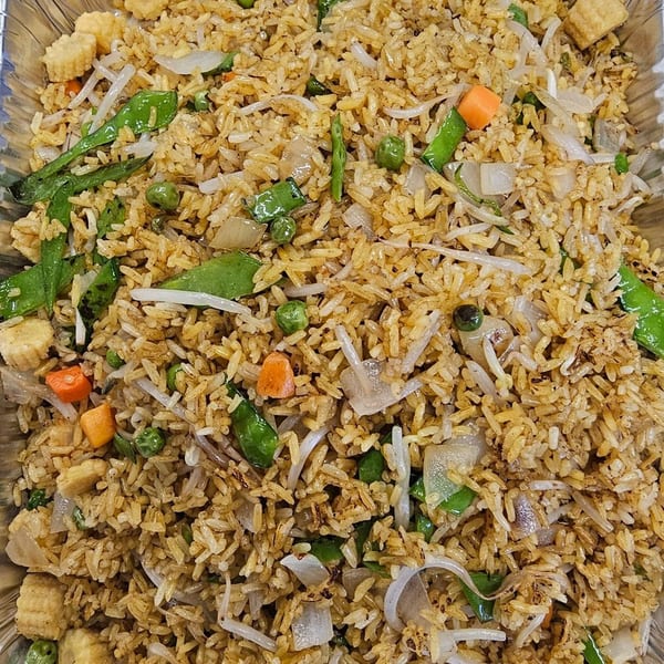Close-up of Mr Nosh's Chinese fried rice with vegetables, baby corn, and bean sprouts.